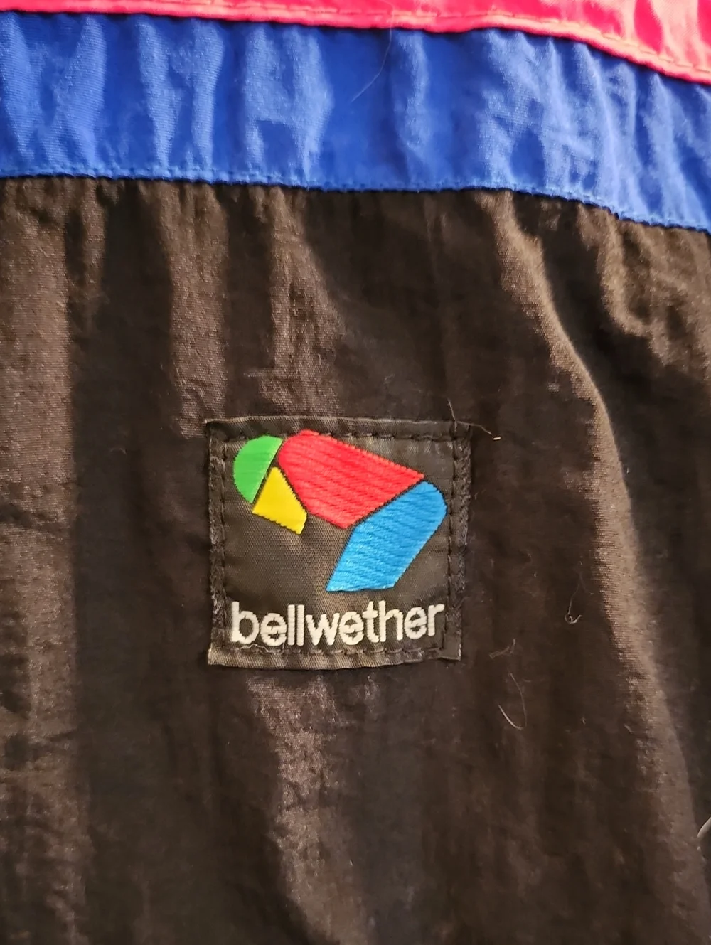 Bellwether Men’s Black & Royal Blue Windbreaker Jacket with Pink Accents